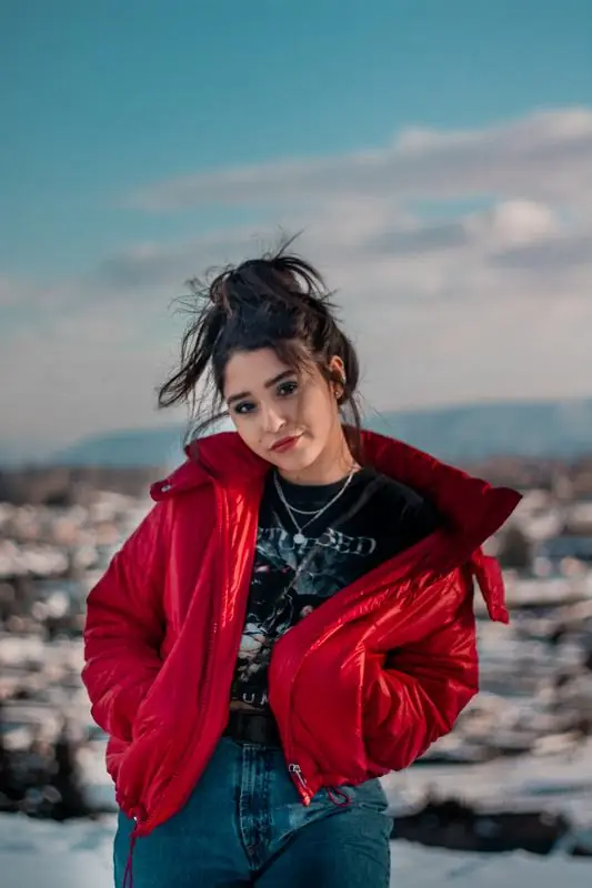 Woman in a red jacket in the snow