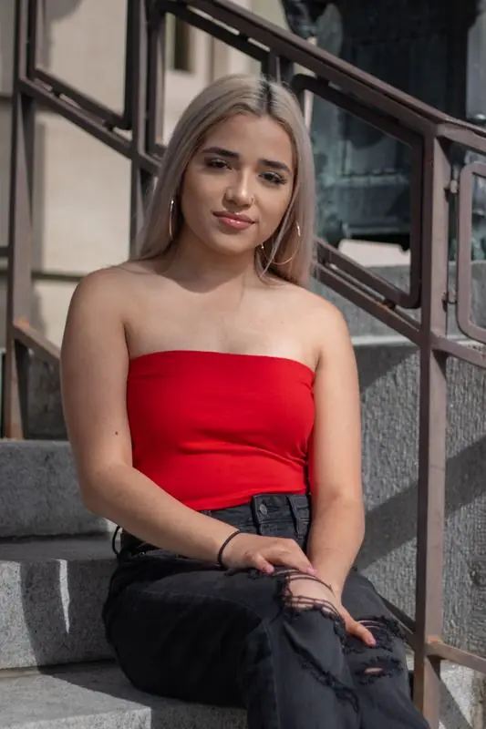 Young woman sitting on outdoor steps