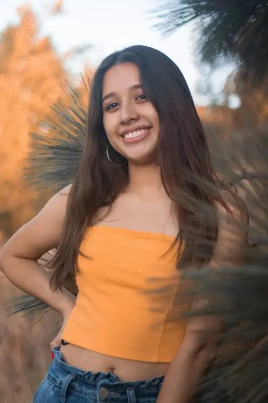 Smiling woman in a yellow top