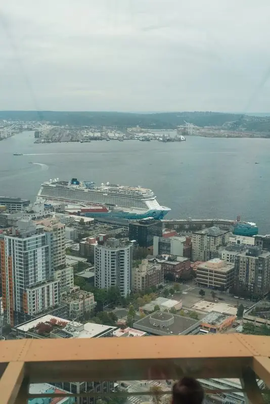 Aerial view of a harbor city with a cruise ship
