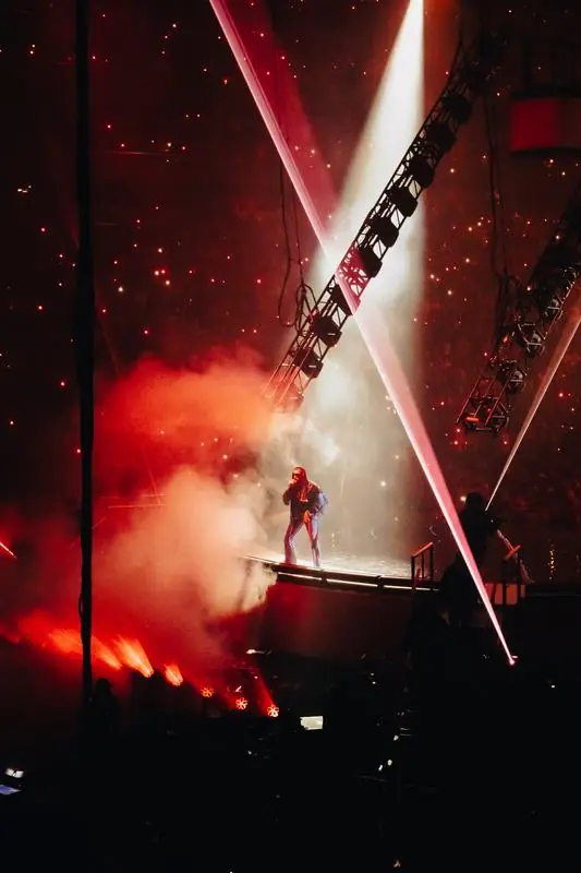 Performer with red lighting and smoke
