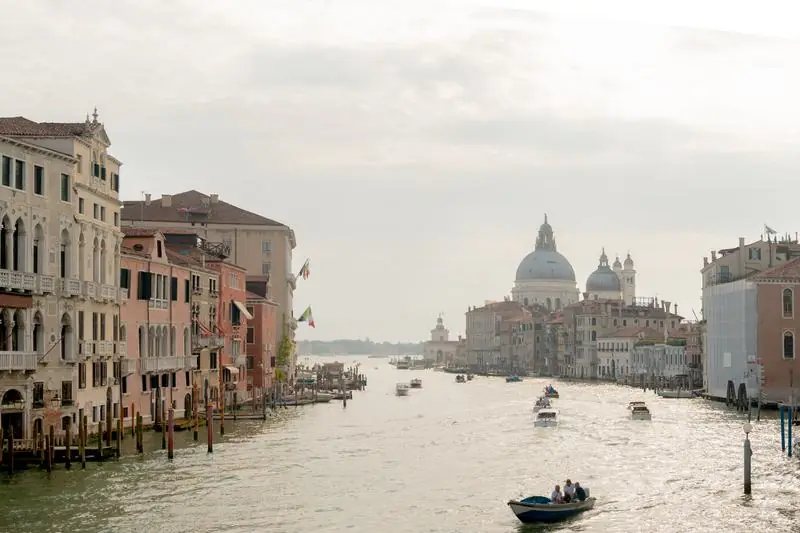Venice Grand Canal with gondolas and historic buildings