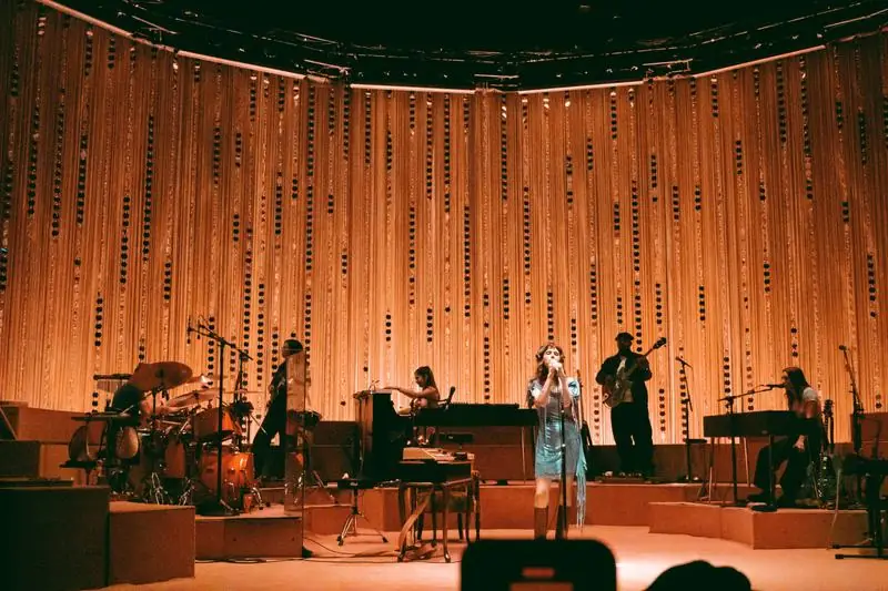 Band in front of a wooden backdrop