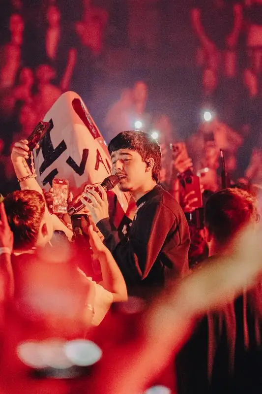 Singer surrounded by fans